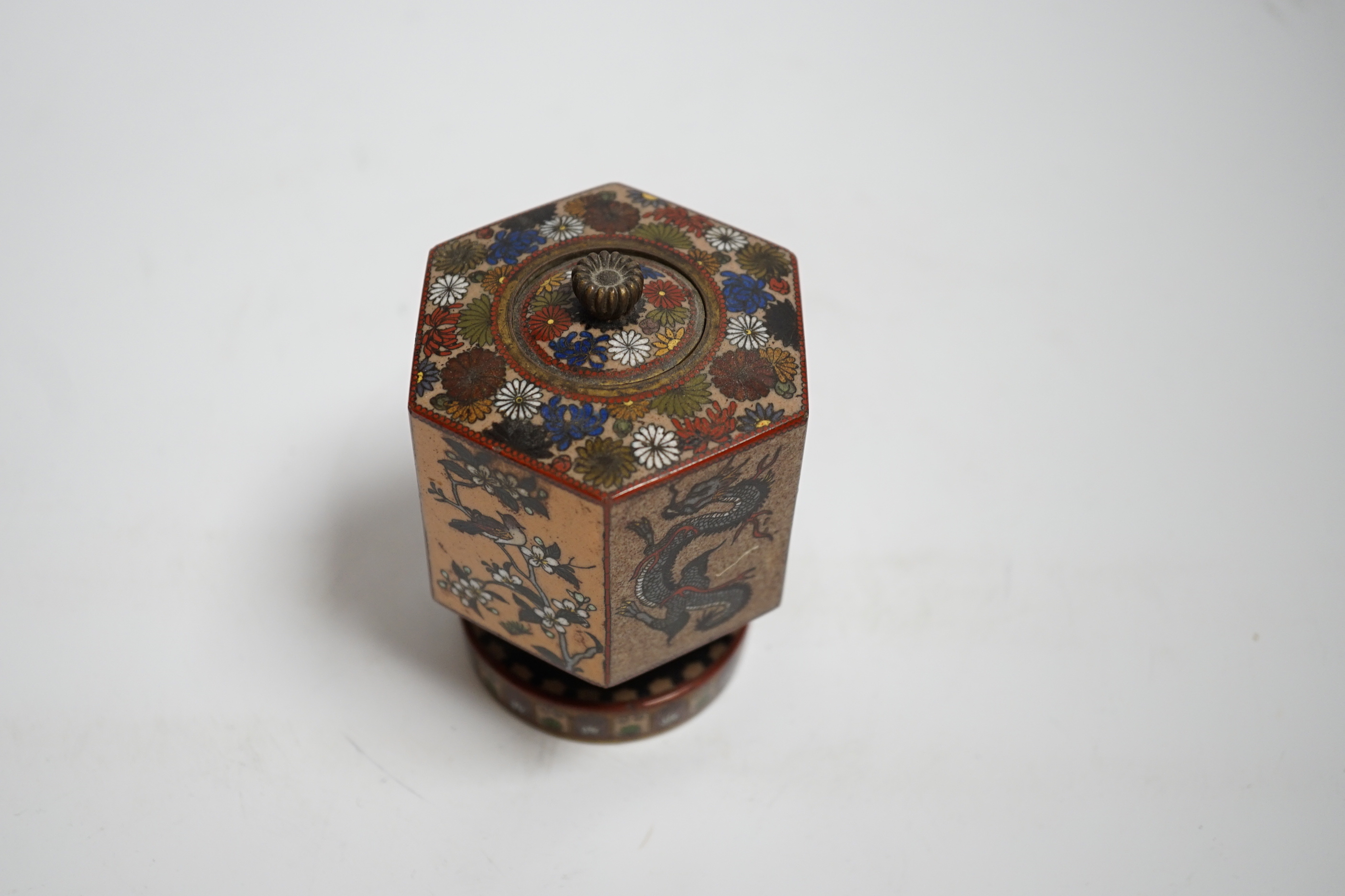 A Japanese hexagonal pedestal cloisonné enamel jar and cover, Meiji period, 10cm high